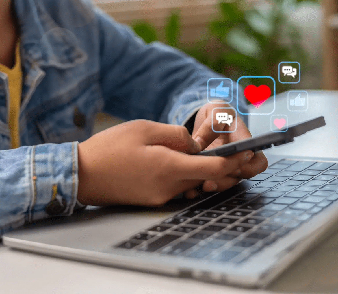 Person using smartphone with social media icons