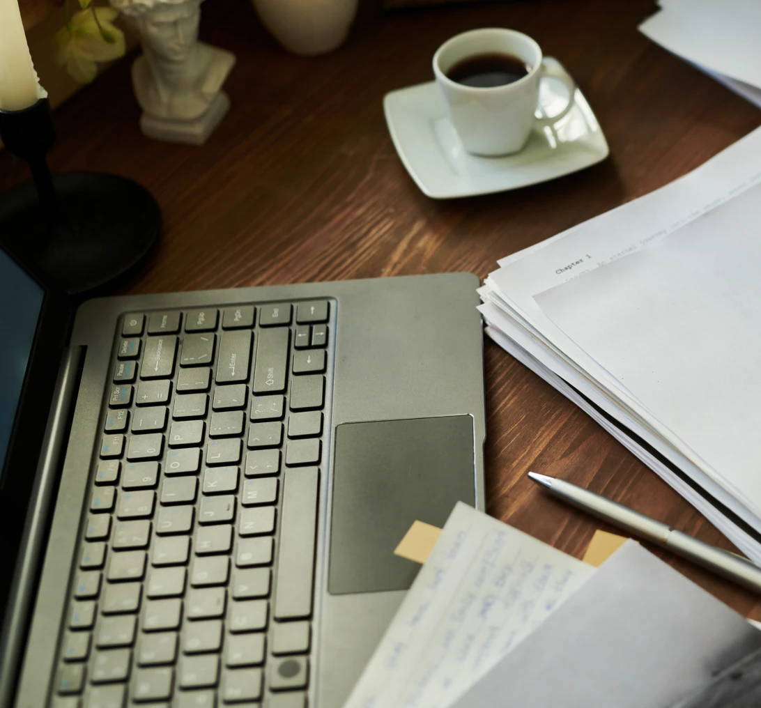 Workspace with keyboard and paperwork